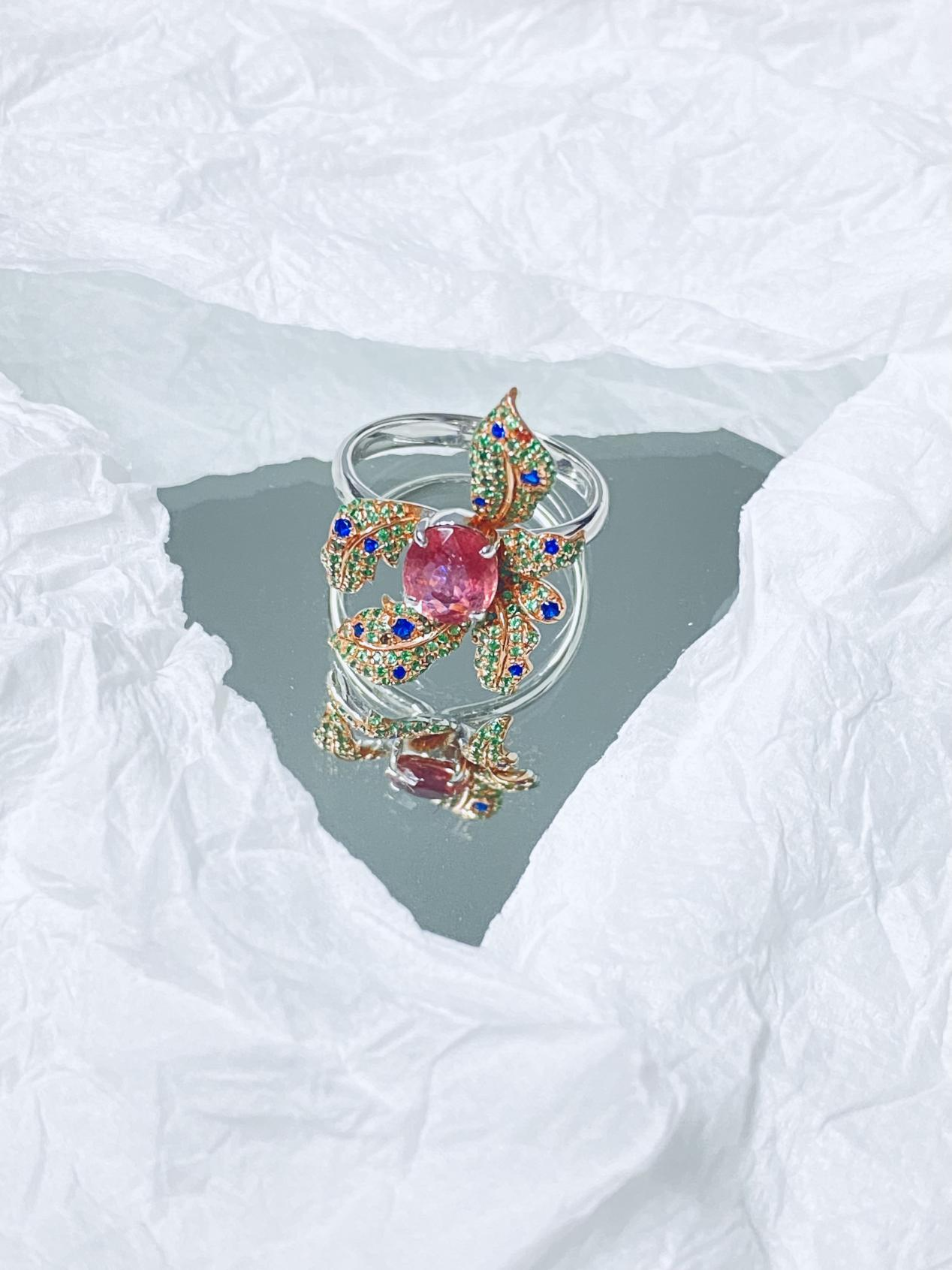 A ring surrounded by flowers in multiple colors