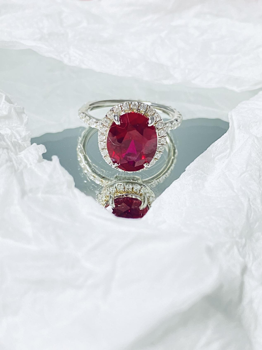 Oval bezel ring with pigeon blood rubies