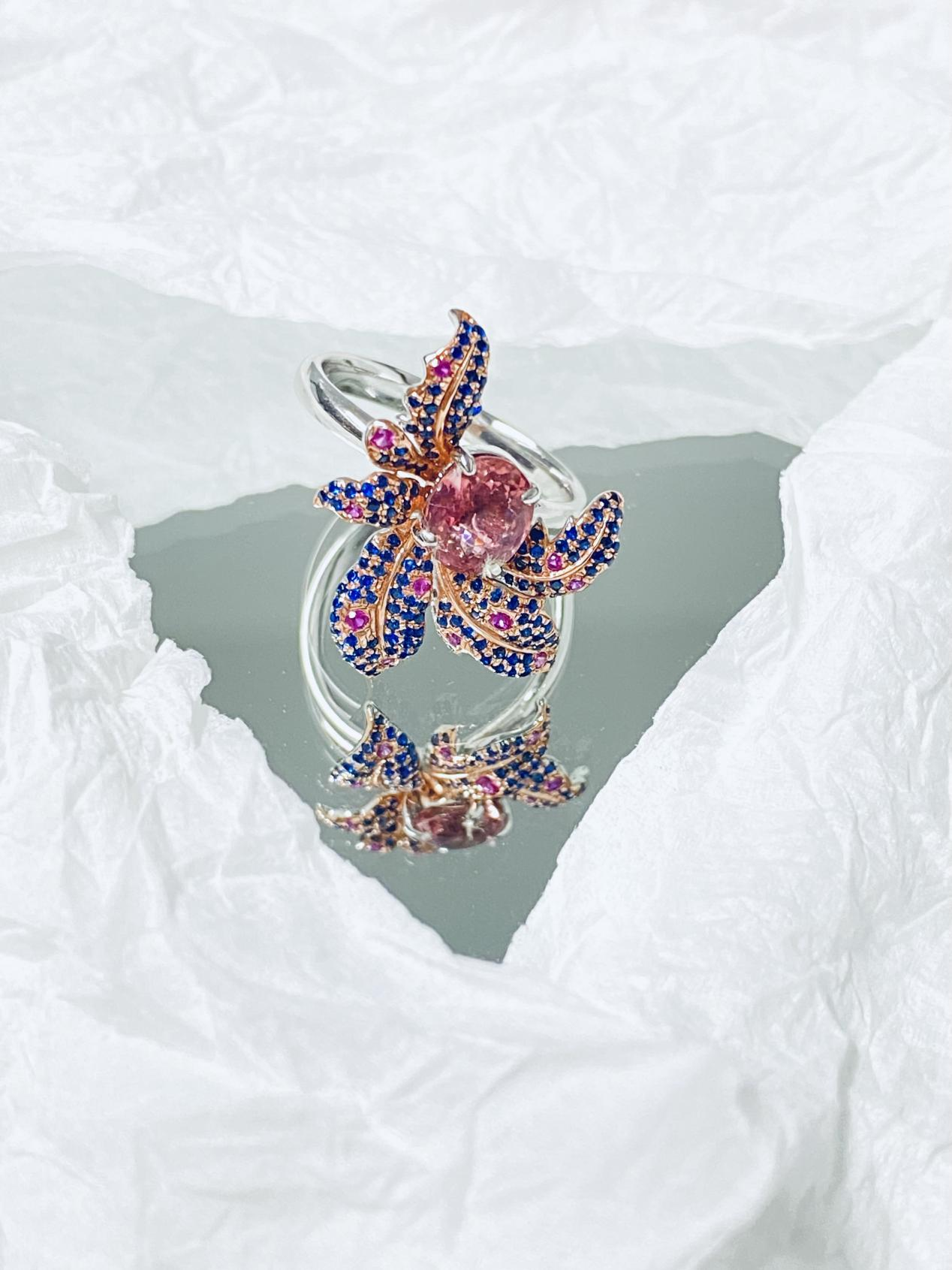A ring surrounded by flowers in multiple colors