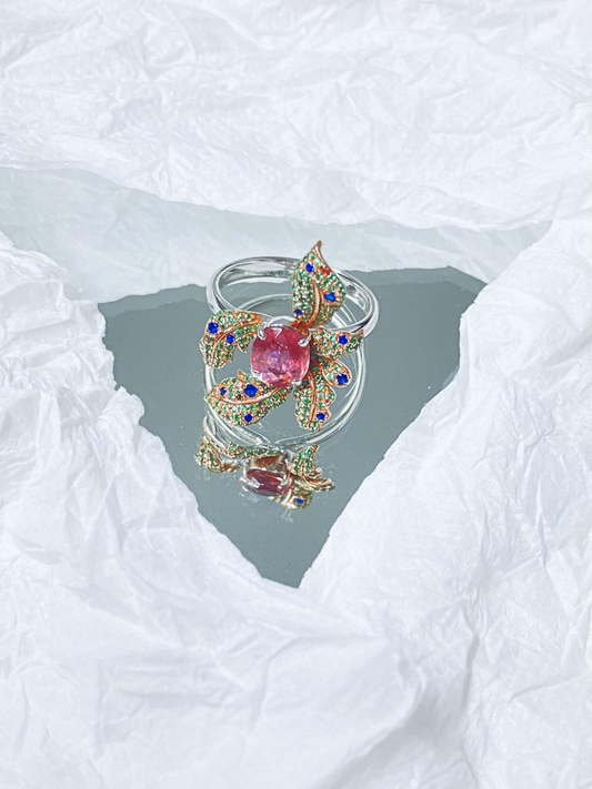 A ring surrounded by flowers in multiple colors